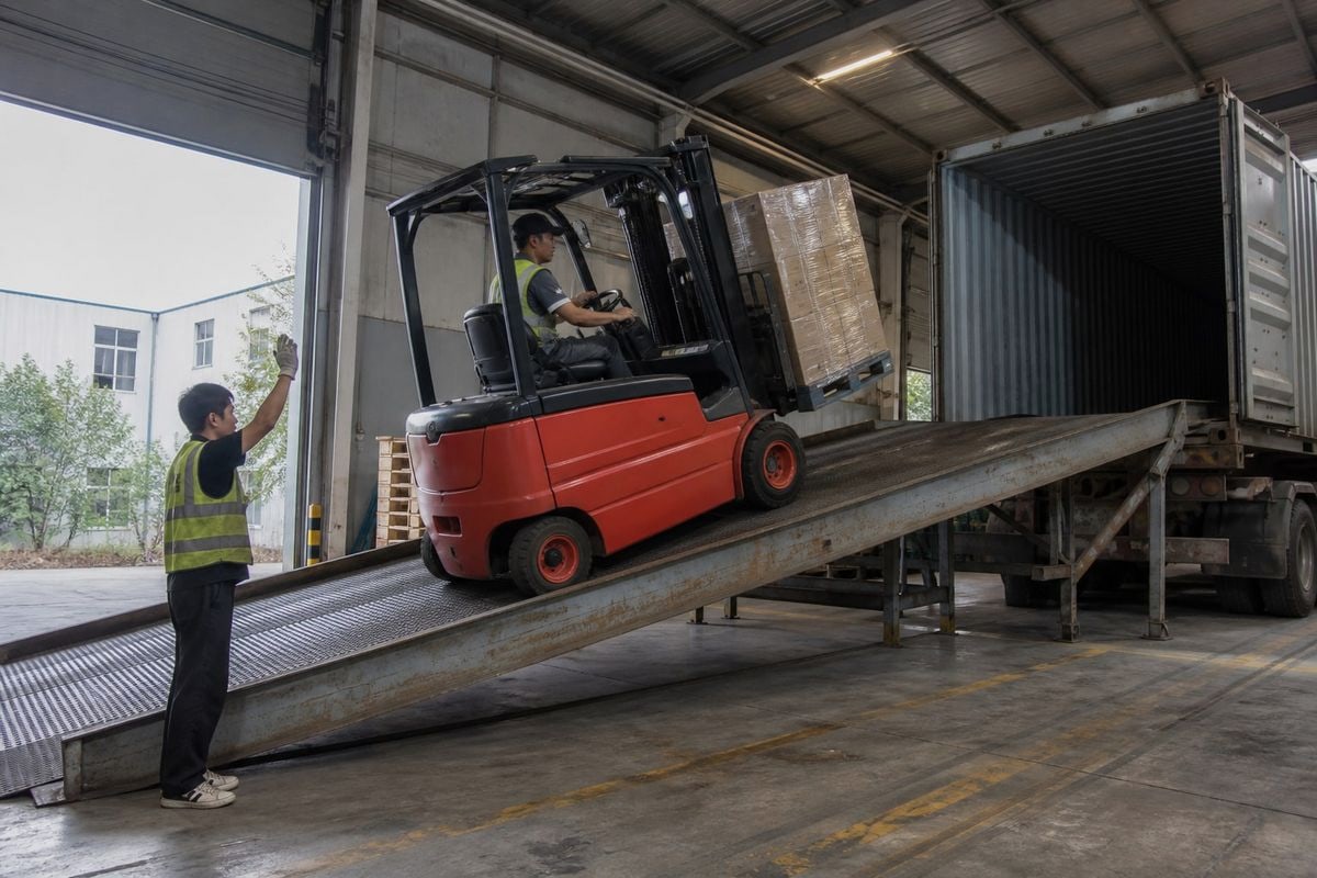 Oversized forklift loaded fully assembled using open-top container or RoRo service (ID#4)